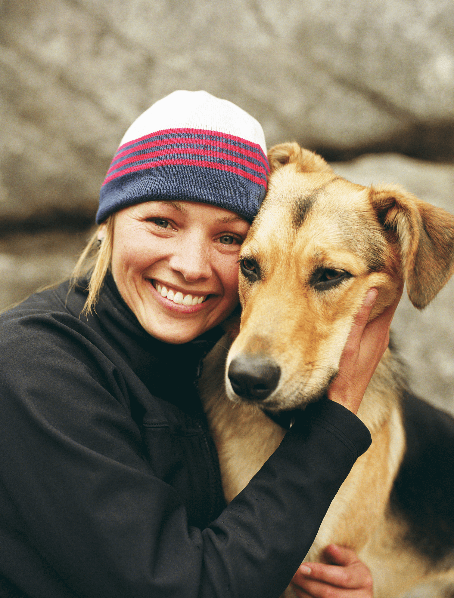 Woman-wearing-knit-cap,-hugging-dog,-portrait-200117076-001_1509x1990